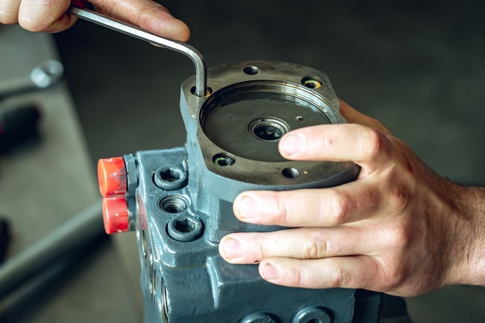 A Person is Fixing a Valve With a Wrench — Burmec In Narrabri, NSW