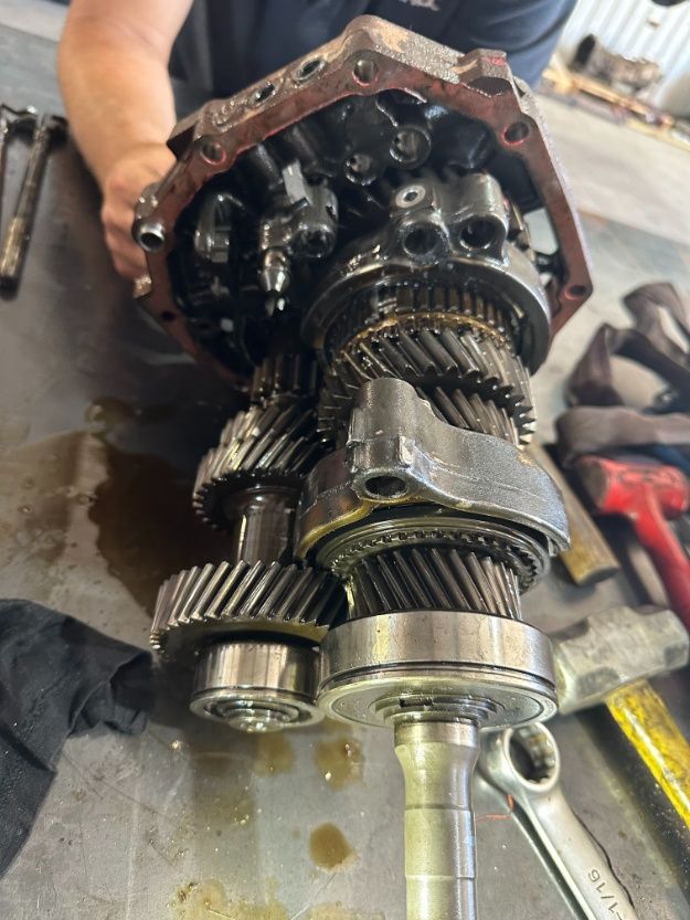 A Man is Working on a Gearbox in a Garage — Burmec In Narrabri, NSW
