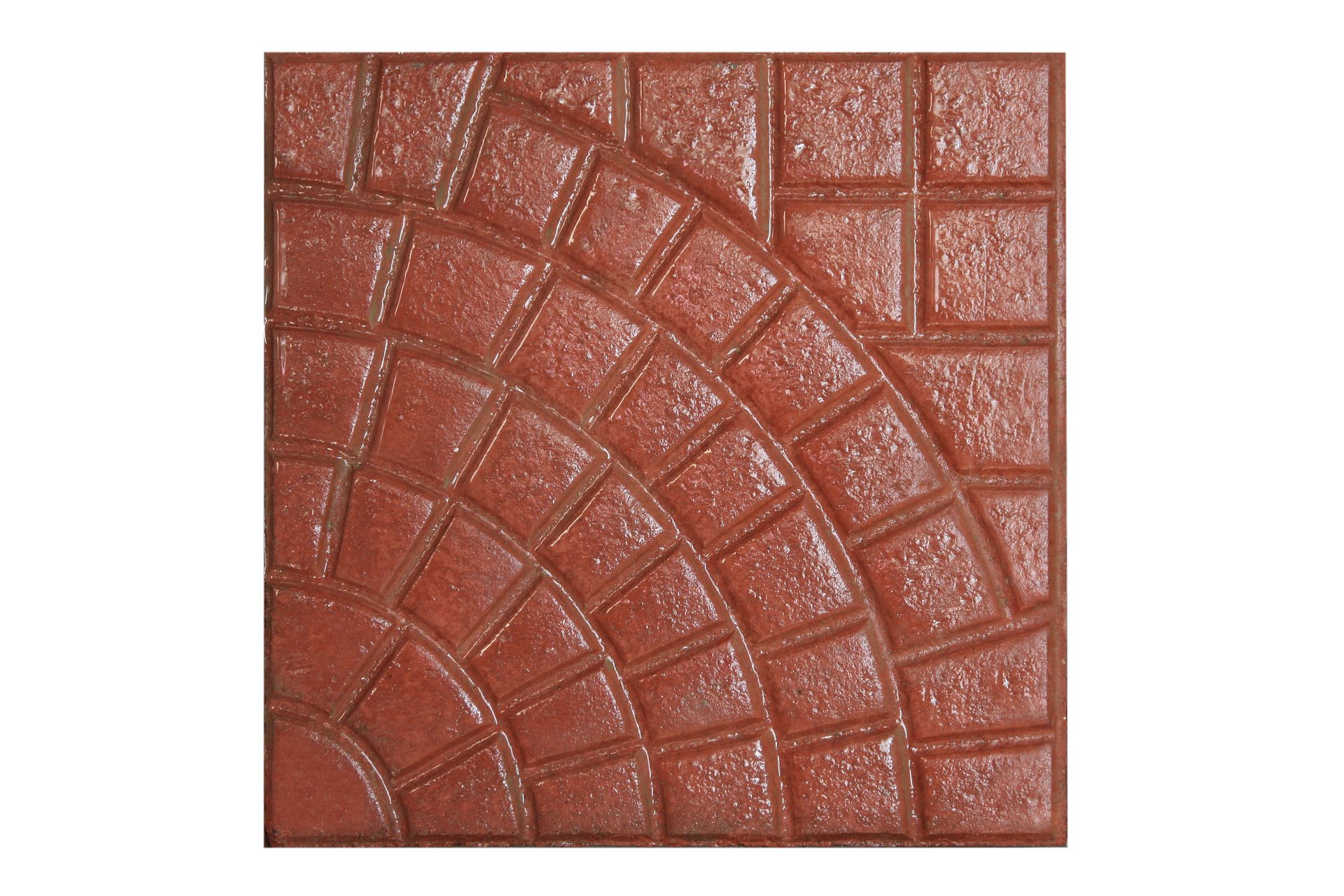 Piastrella quadrata in mattoni rossi con motivo a ventaglio in un angolo e a griglia nell'altro.