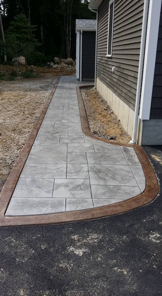 coloured and stained in dark orange concrete walkway