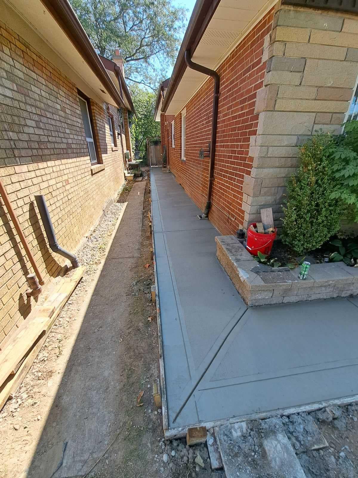 concrete sidewalk around home with brushed finish