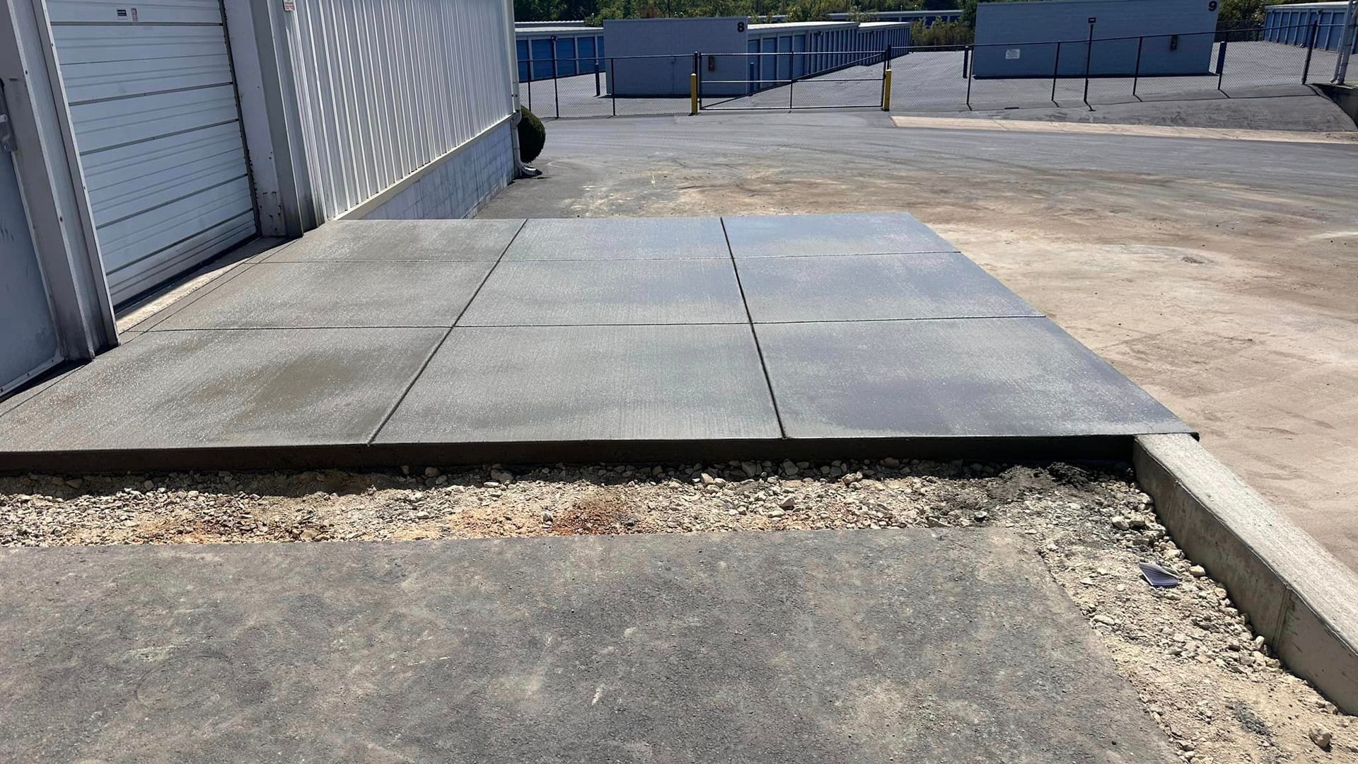 A concrete slab is being built in a parking lot