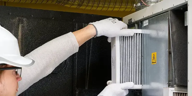 Lady  Removing Dirty Air Filter