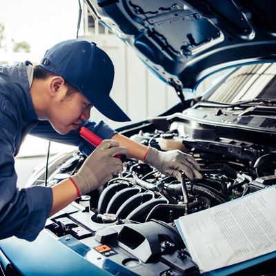 Mechanic Checking Car Engine for Log Book — Brake Repairs in Palmerston, NT