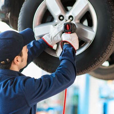 Mechanic Fixing 4WD Tyres — Brake Repairs in Palmerston, NT