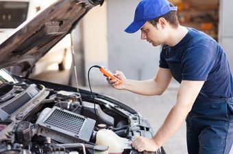 Mechanic Checking Car Diagnostics — Brake Repairs in Palmerston, NT