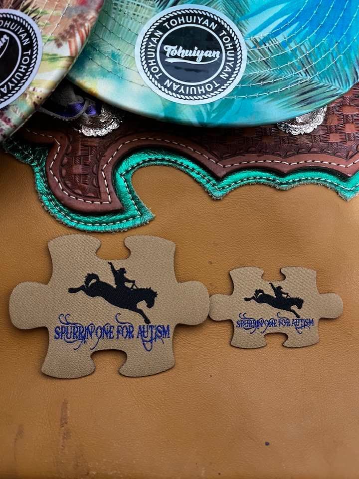 A pair of puzzle pieces with a person riding a horse on them.