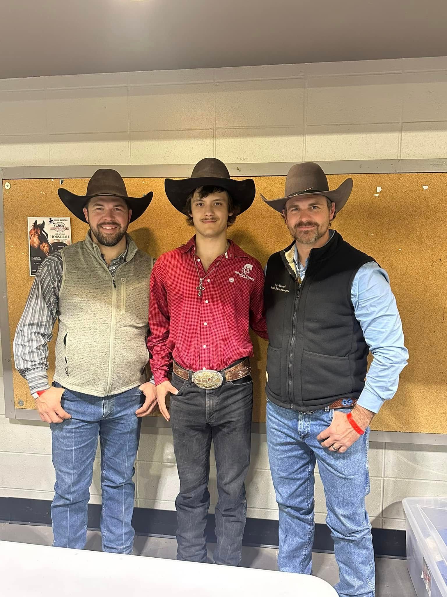 Three men wearing cowboy hats are posing for a picture.