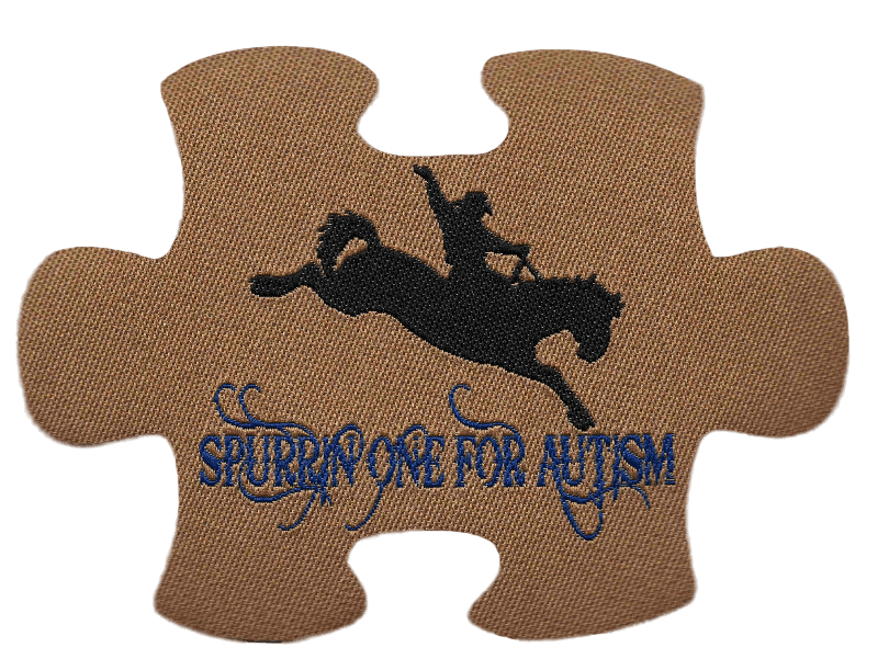 a jig saw puzzle piece with a bucking horse says spurrin one for autism