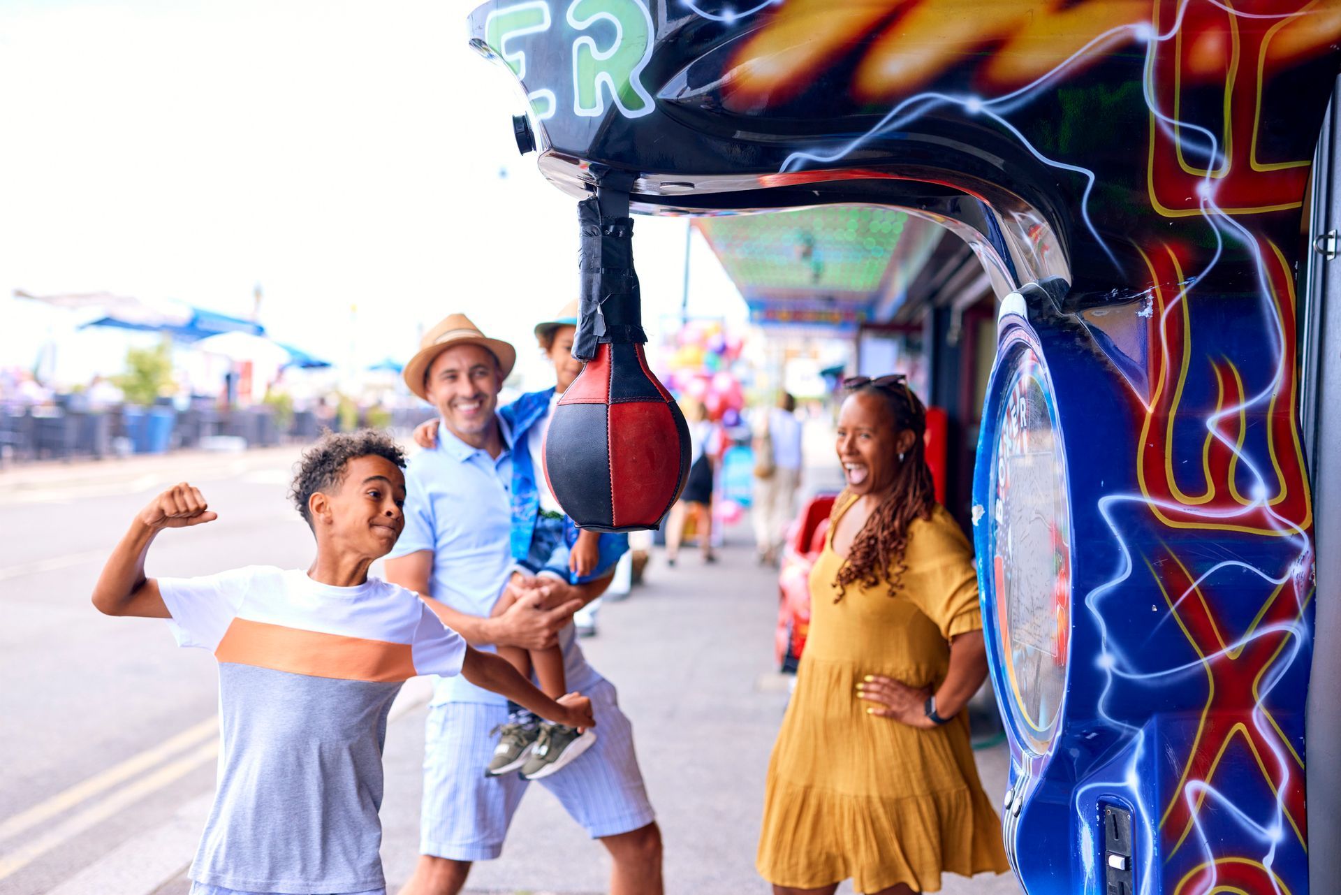 A family is playing a game at a carnival.