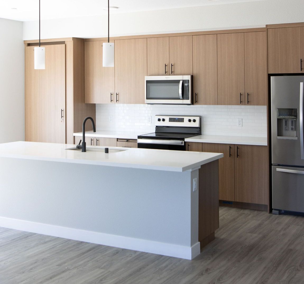 Apartment designer kitchen with waterfall island at The Hayley.