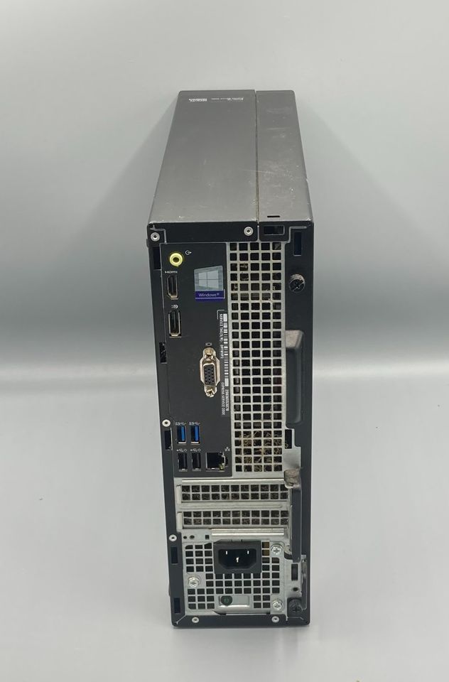 Dell OptiPlex 7050 desktop computer, black tower with silver top, front view.