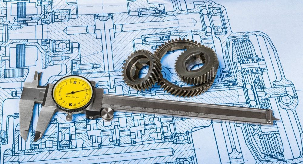 Calipers Measuring Gears on A Blueprint — SAE Engineering in Tablelands, QLD