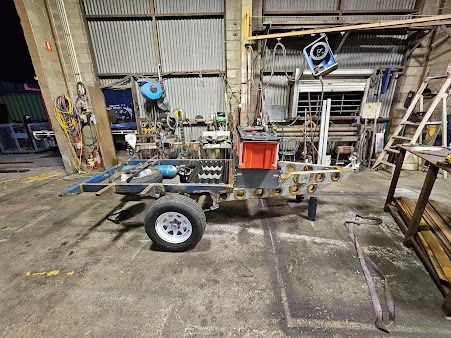 A Custom Trailer with Equipment Inside a Workshop — SAE Engineering in Cape York, QLD