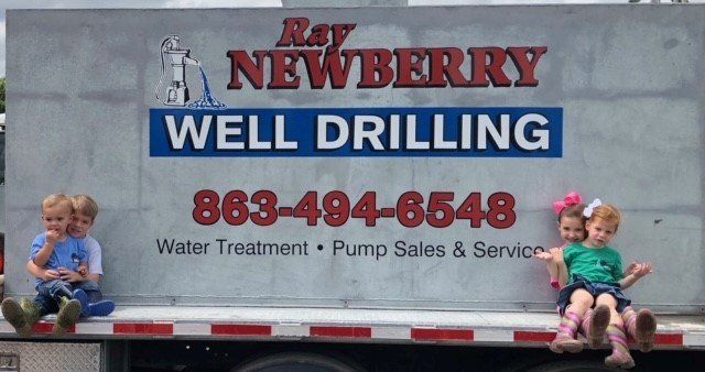 Kids Beside the Signage — Arcadia, FL — Ray Newberry Well Drilling