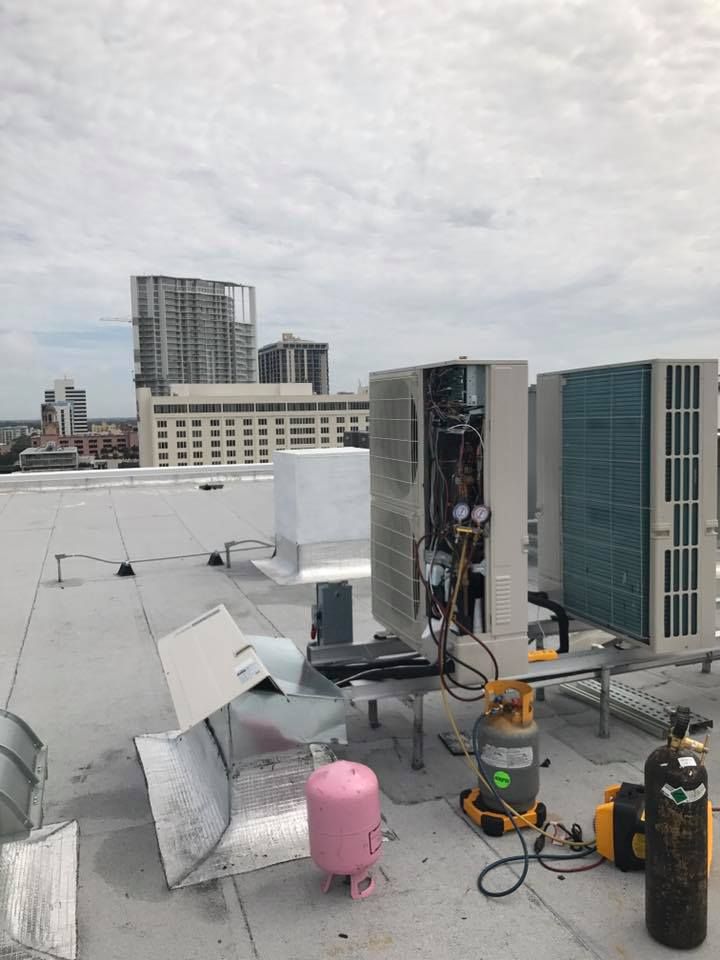 HVAC repair on a rooftop
