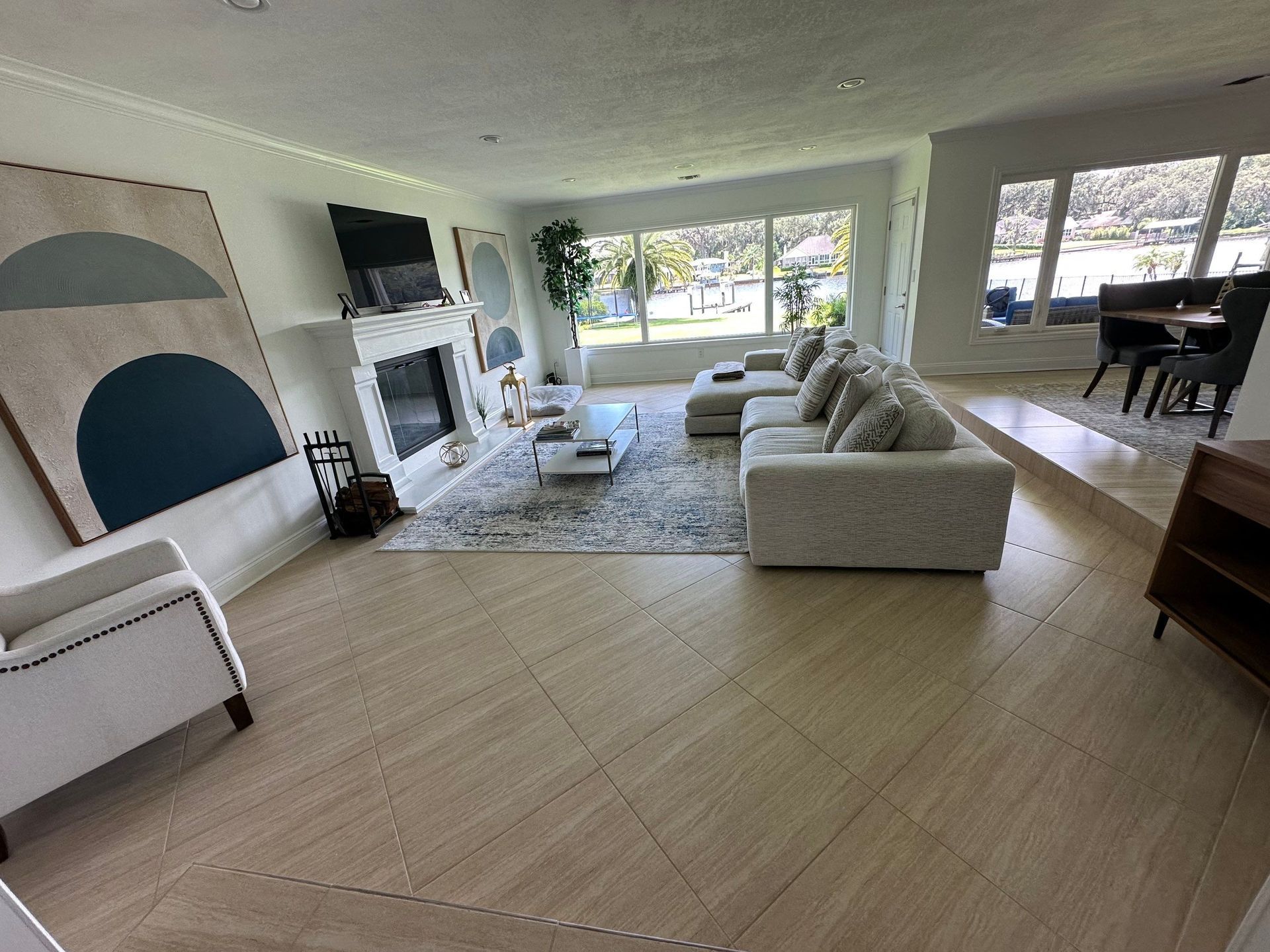 A living room filled with furniture and a fireplace.