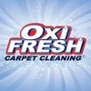 The logo for oxi fresh carpet cleaning is on a blue background.