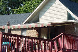 Commercial Retractable Awning Experts — House with Red Fence in Spartanburg, SC