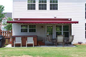 Retractable Awning Company — Simple Red Retractable Awning in Spartanburg, SC