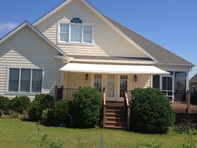 Retractable Awnings — Simple House with White Awning in Spartanburg, SC