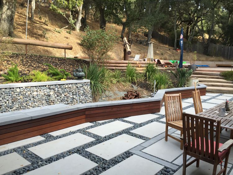 A person is using a drill to drill a hole in a piece of wood.