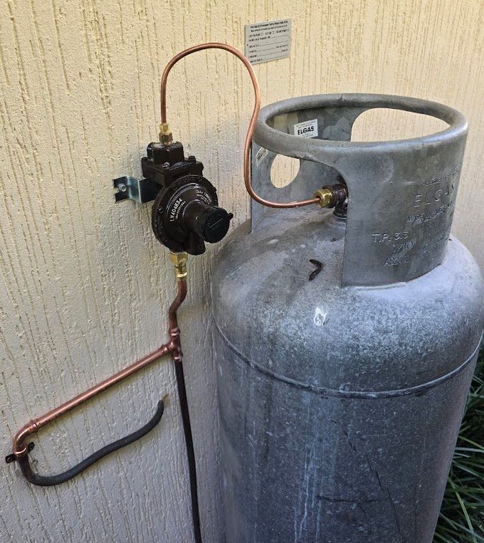 A Wall Mounted Water Fountain With Copper Pipes Attached To It — Country 2 Coast Plumbing And Gas In Wauchope, NSW