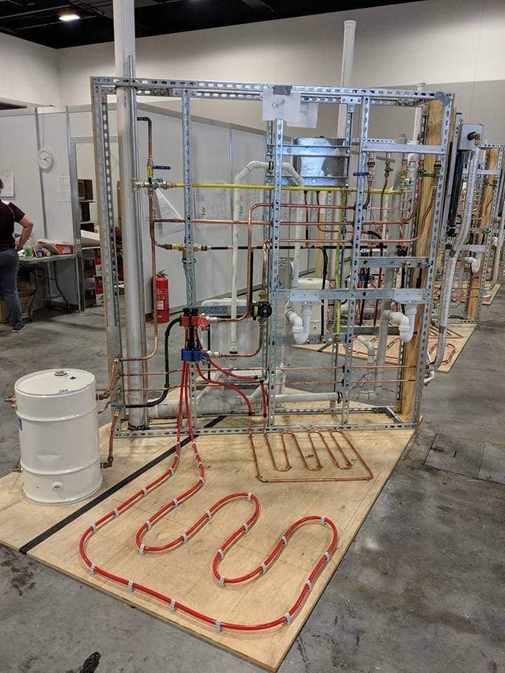 A Warehouse With A Lot Of Pipes And Wires On The Floor — Country 2 Coast Plumbing And Gas In Wauchope, NSW 