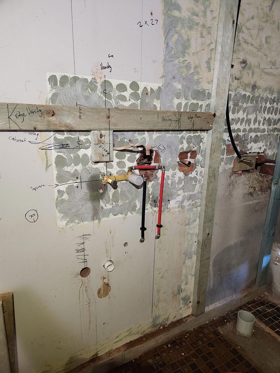 A Faucet Is Hanging From A Wall In A Room — Country 2 Coast Plumbing and Gas In Wauchope, NSW