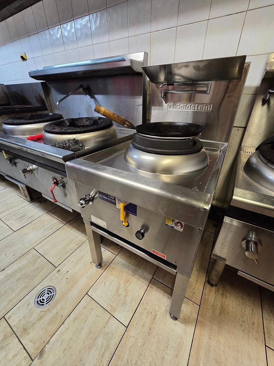 A Row Of Stainless Steel Stove Tops In A Kitchen — Country 2 Coast Plumbing And Gas In Wauchope, NSW
