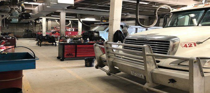 fixing trucks in a garage
