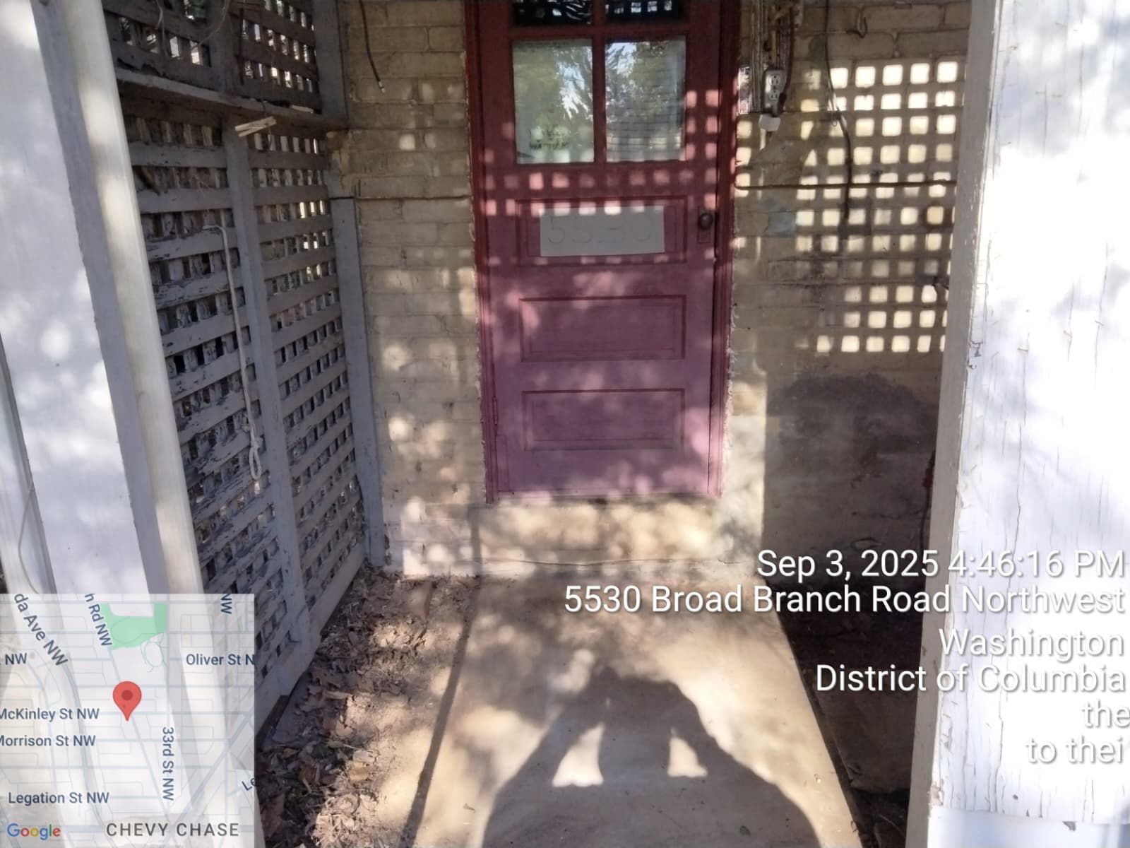 Exterior of a building with a red door, trellis, and a map showing the address 5530 Broad Branch Road Northwest.
