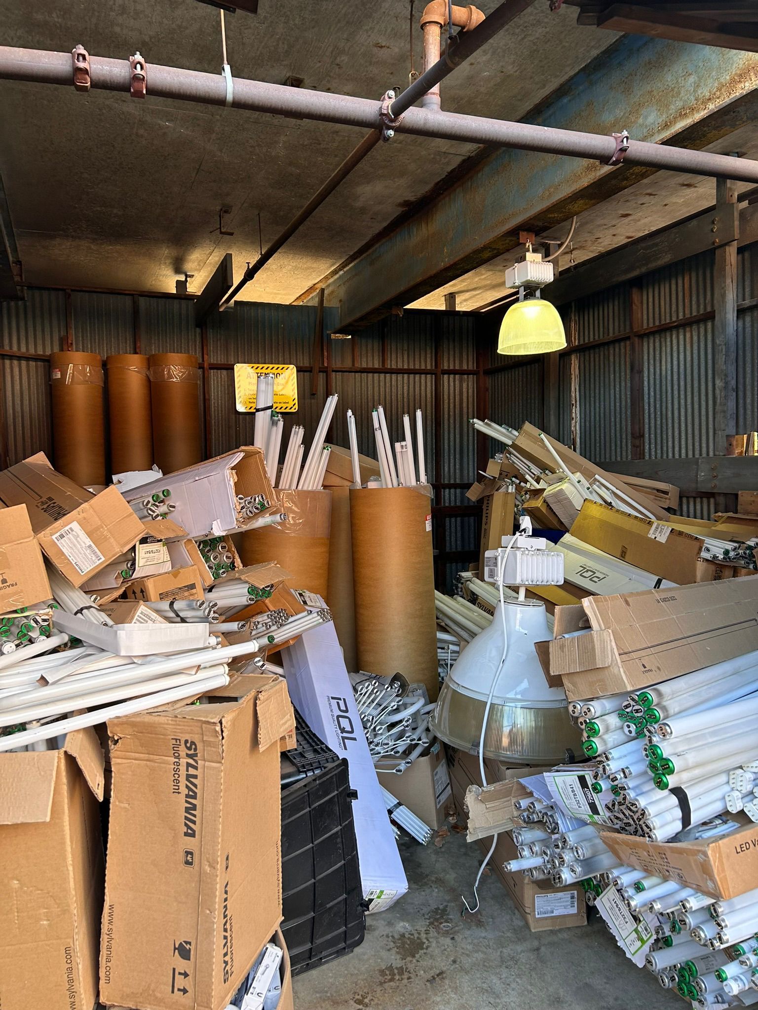 A warehouse filled with lots of boxes and tubes.