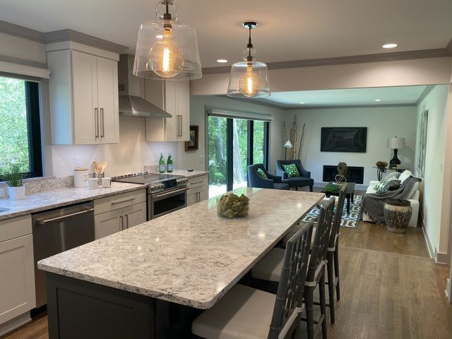 A kitchen with a large island in the middle of it