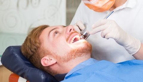 dentist doing gum treatment