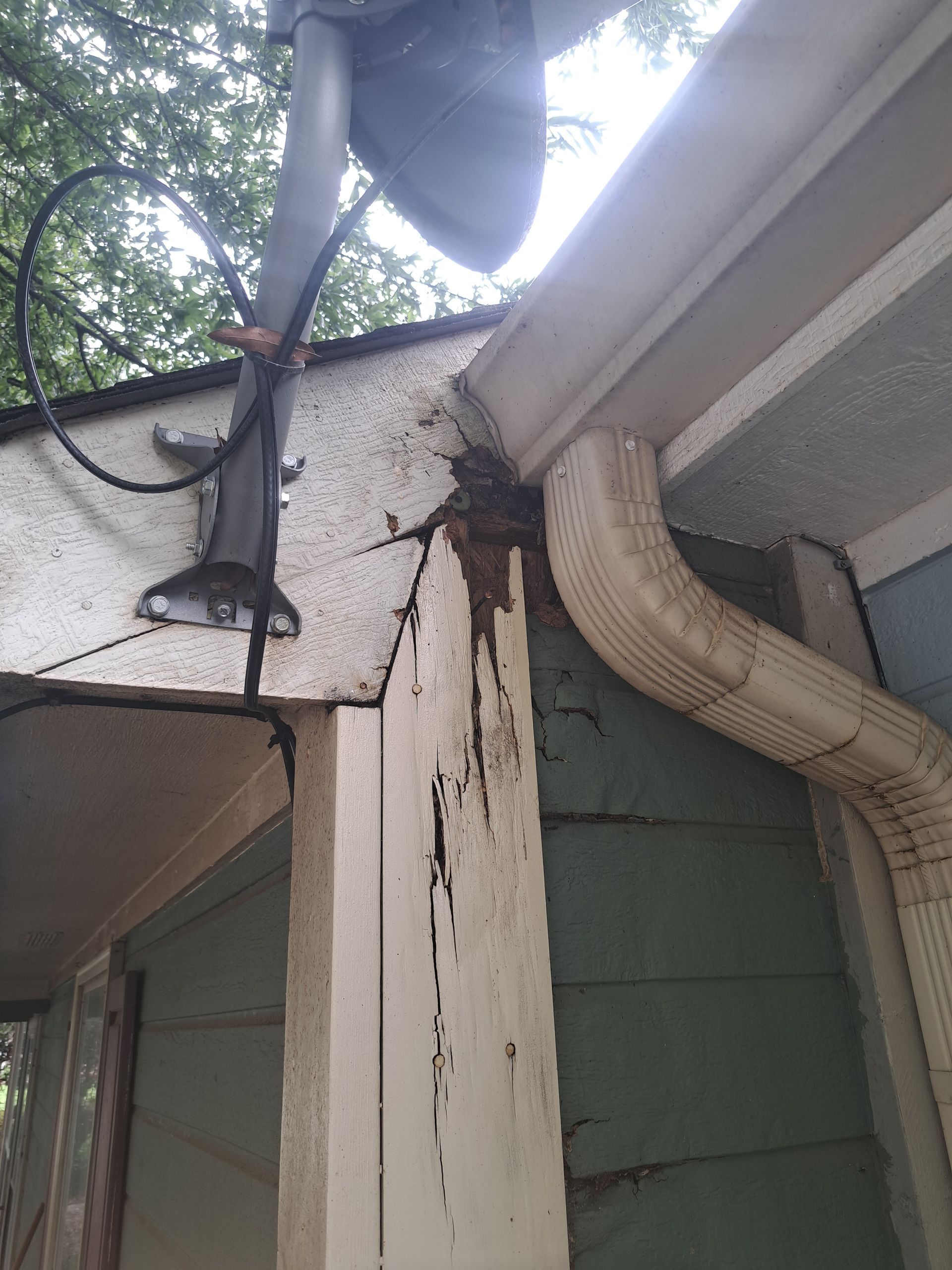 A house with a gutter and a light on the roof