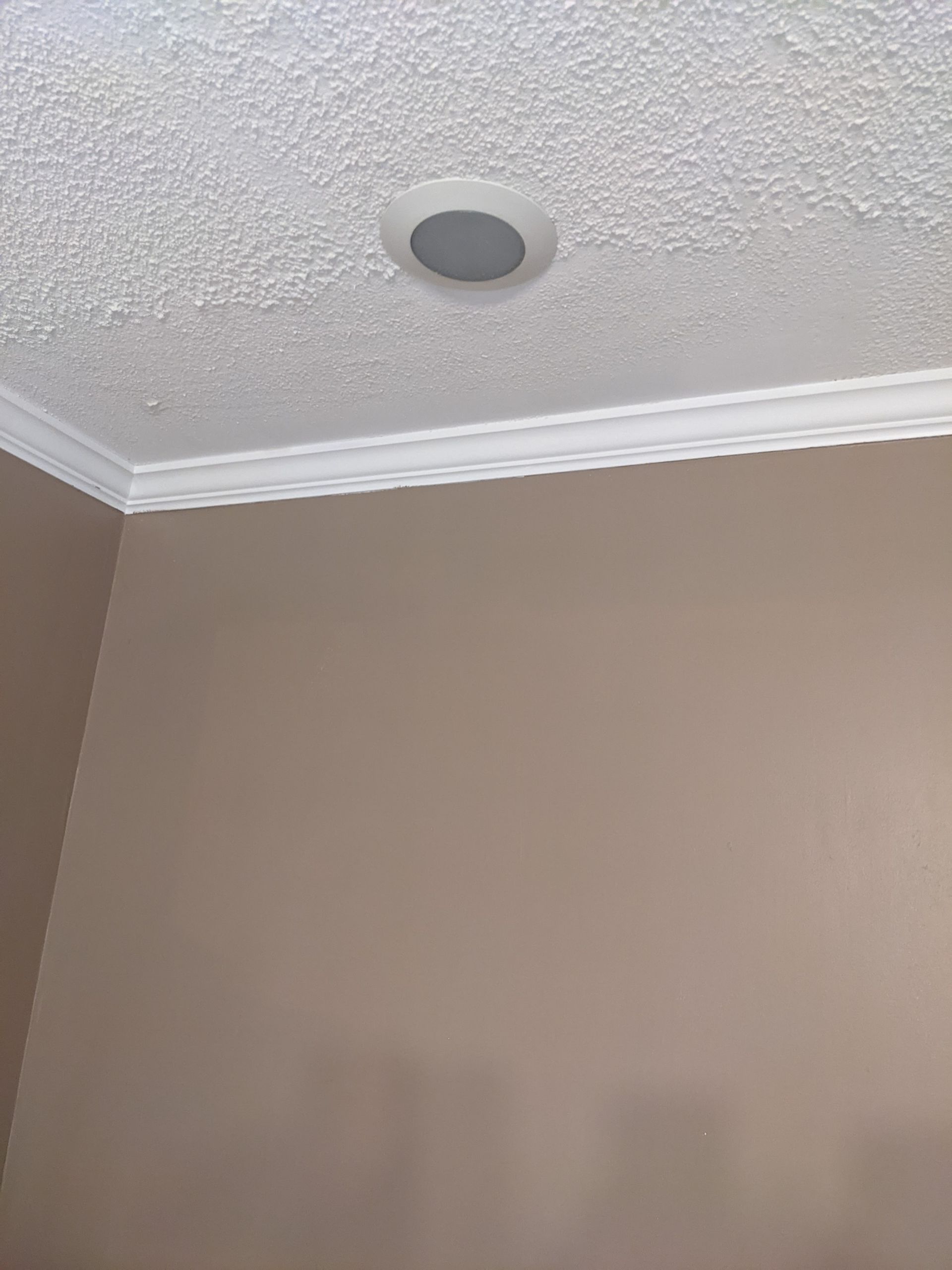 There is a hole in the ceiling in the middle of the room.