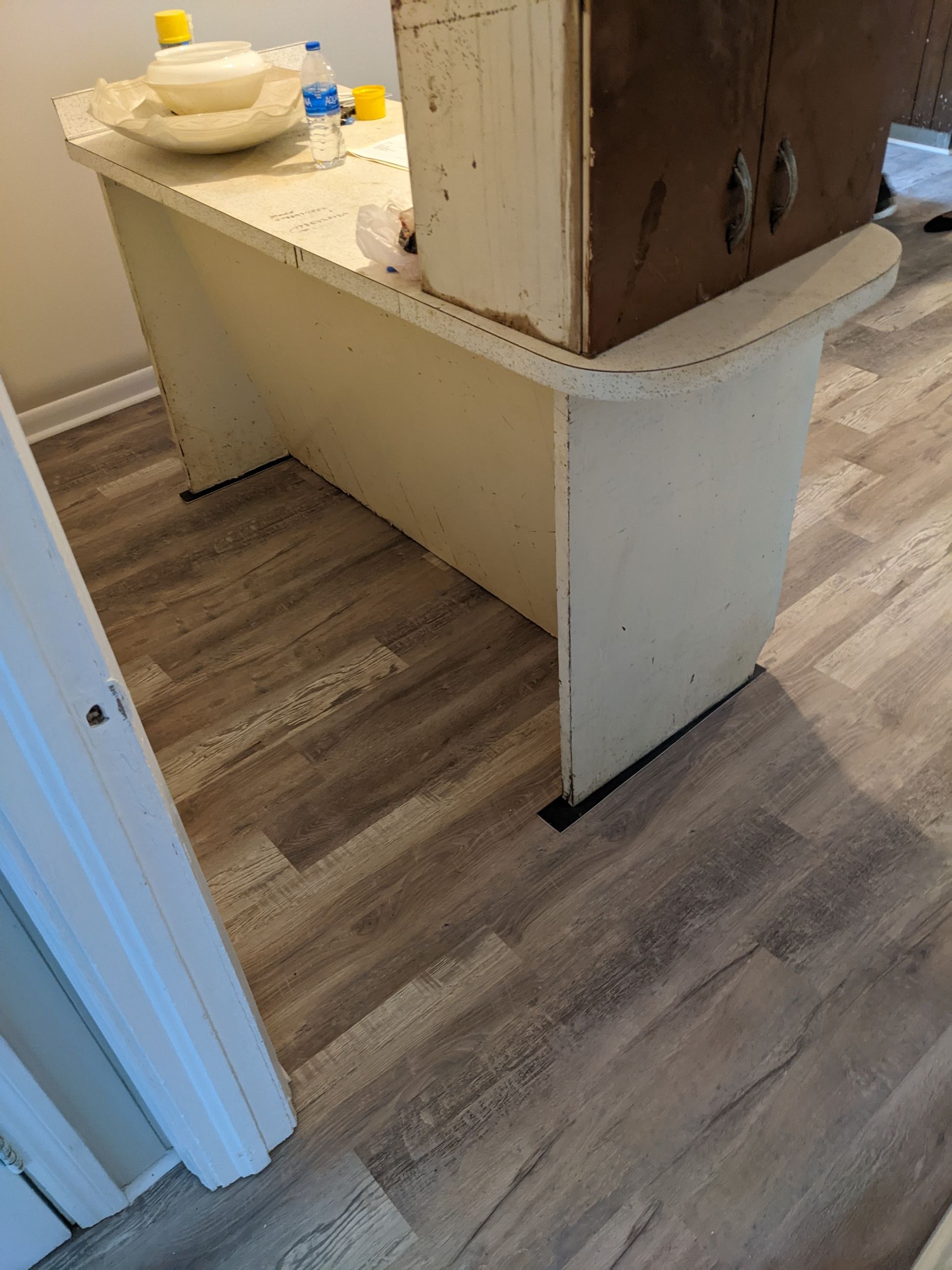 A wooden table with a box on top of it in a room.