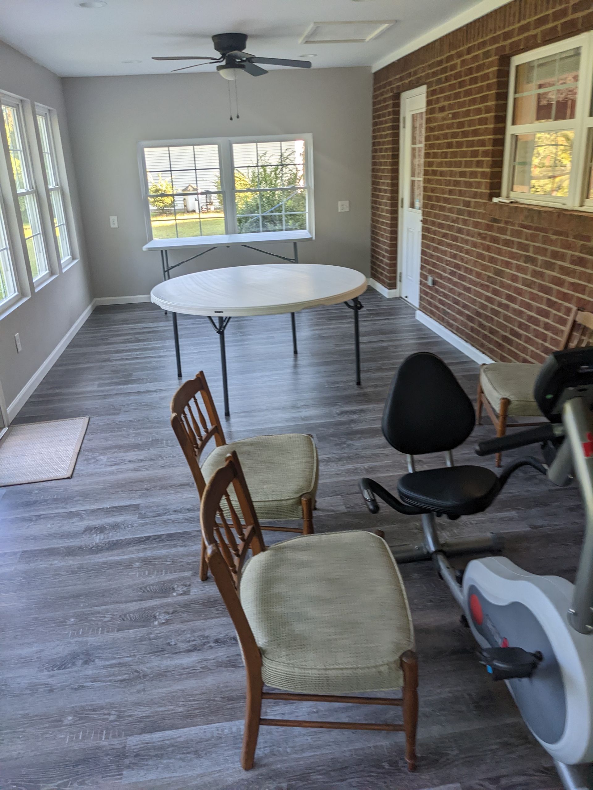 There is a table and chairs in the room.