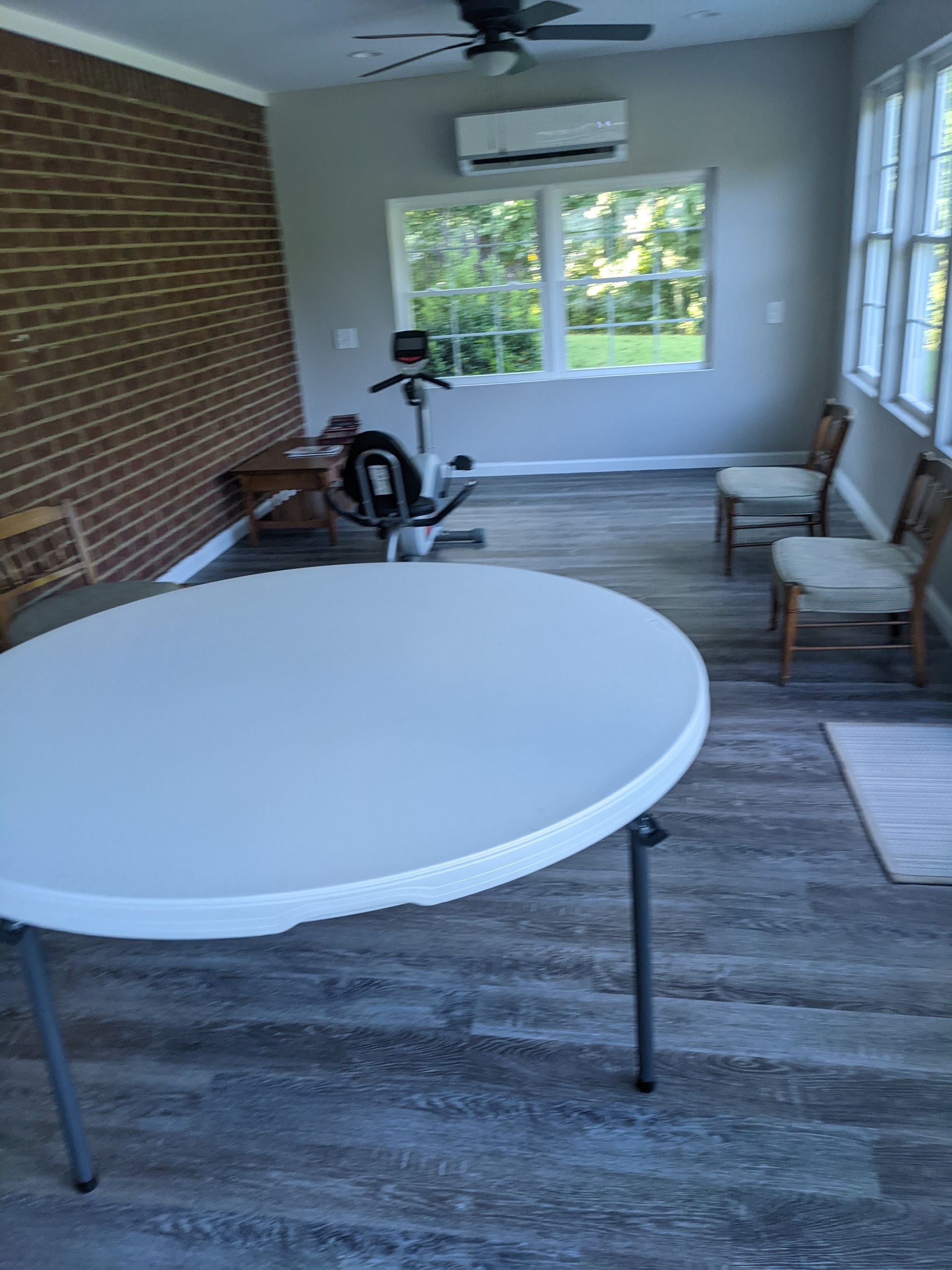 There is a table and chairs in the room.