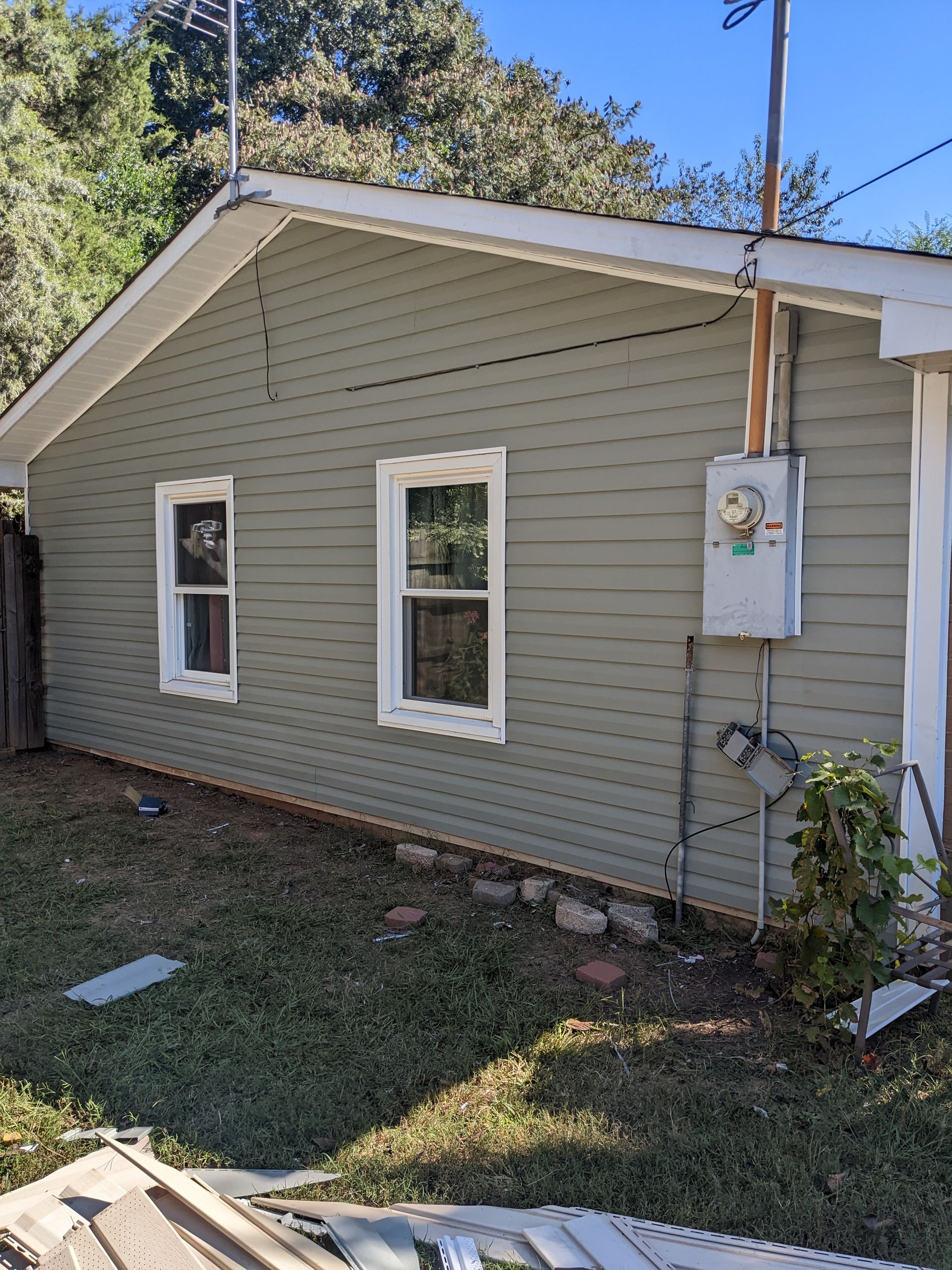 A house with a lot of windows on the side of it.