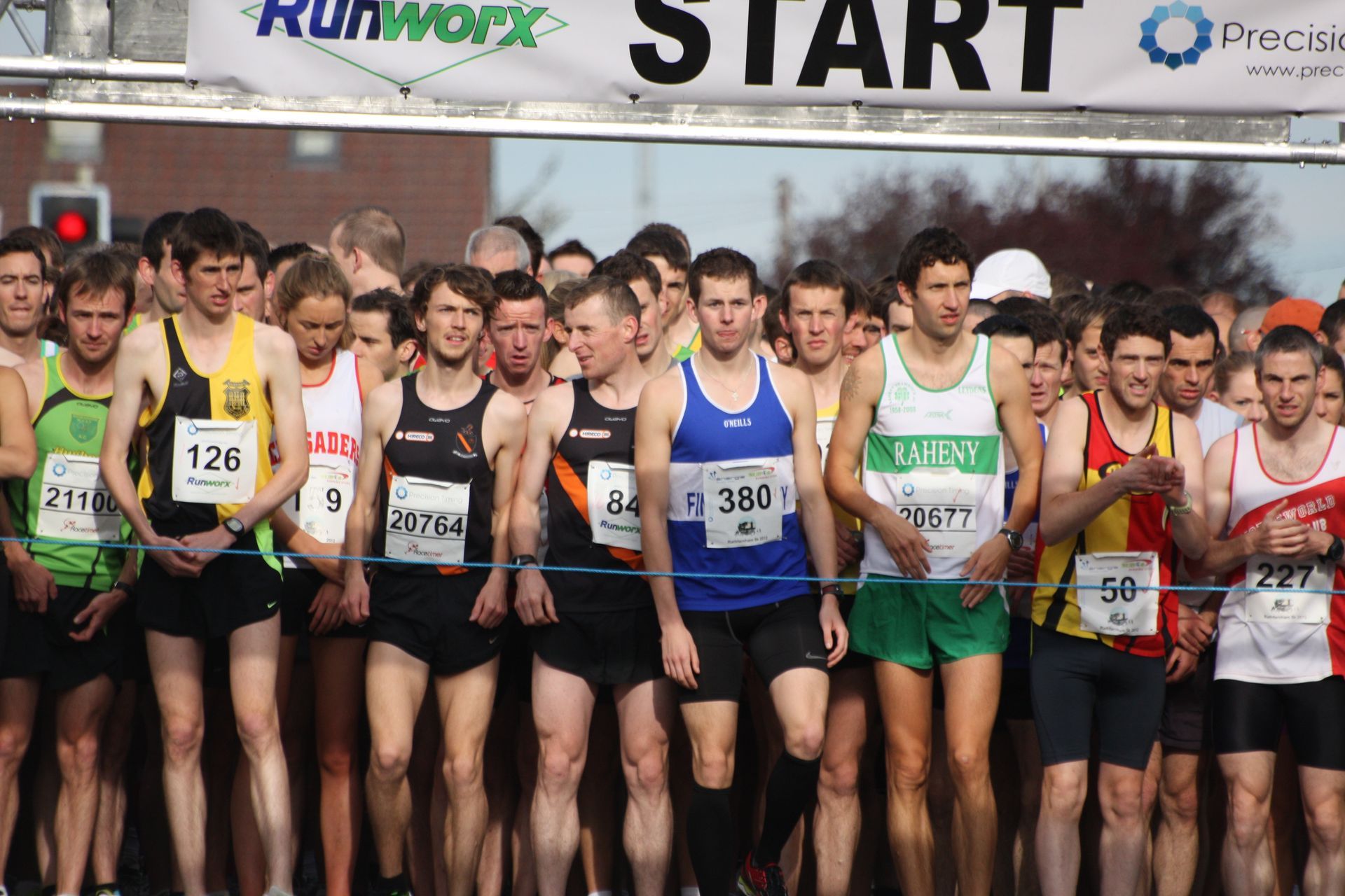 A bunch of runners are getting ready to start a race