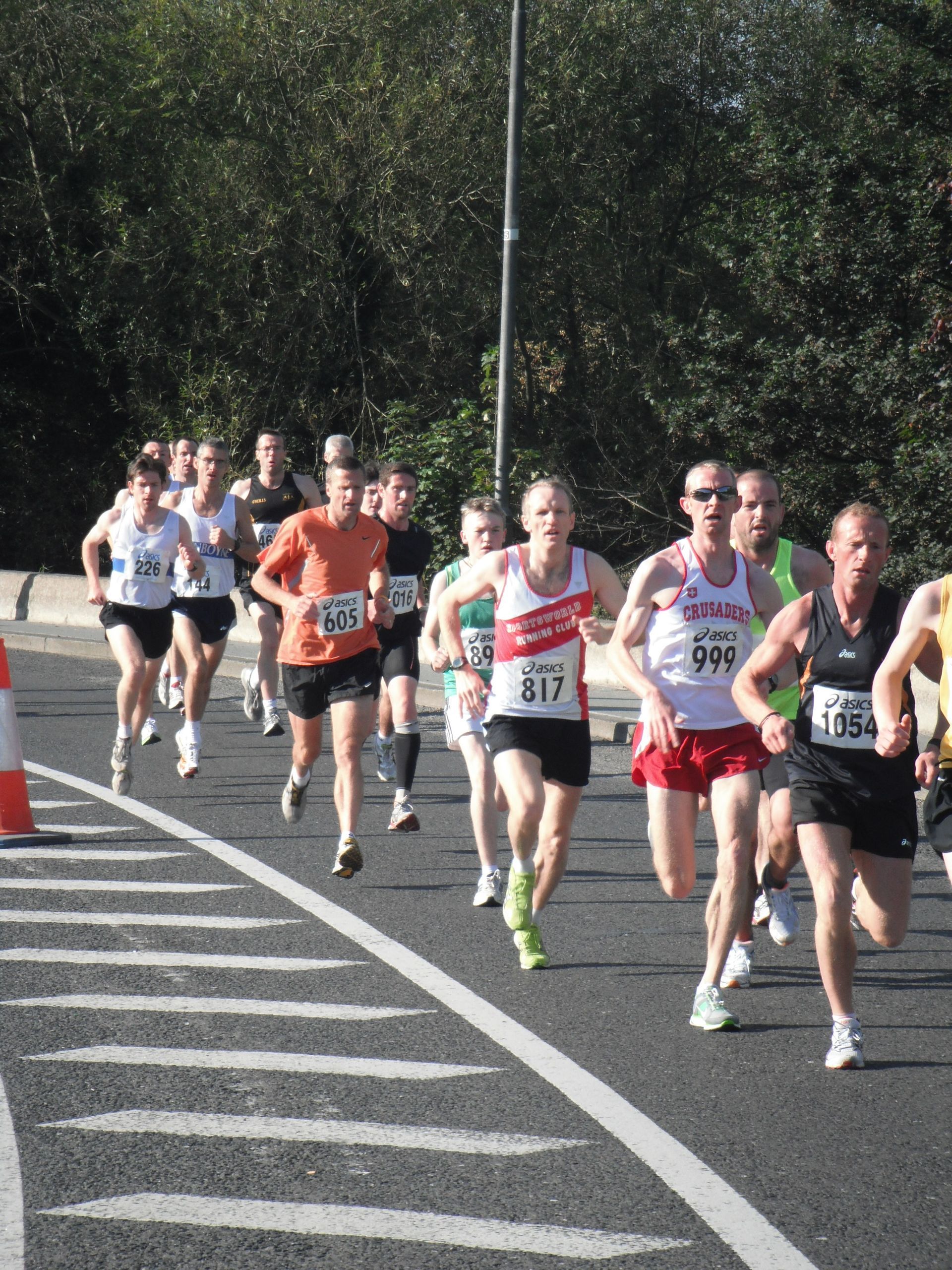 A group of people are running a marathon and one of them has the number 666 on their shirt