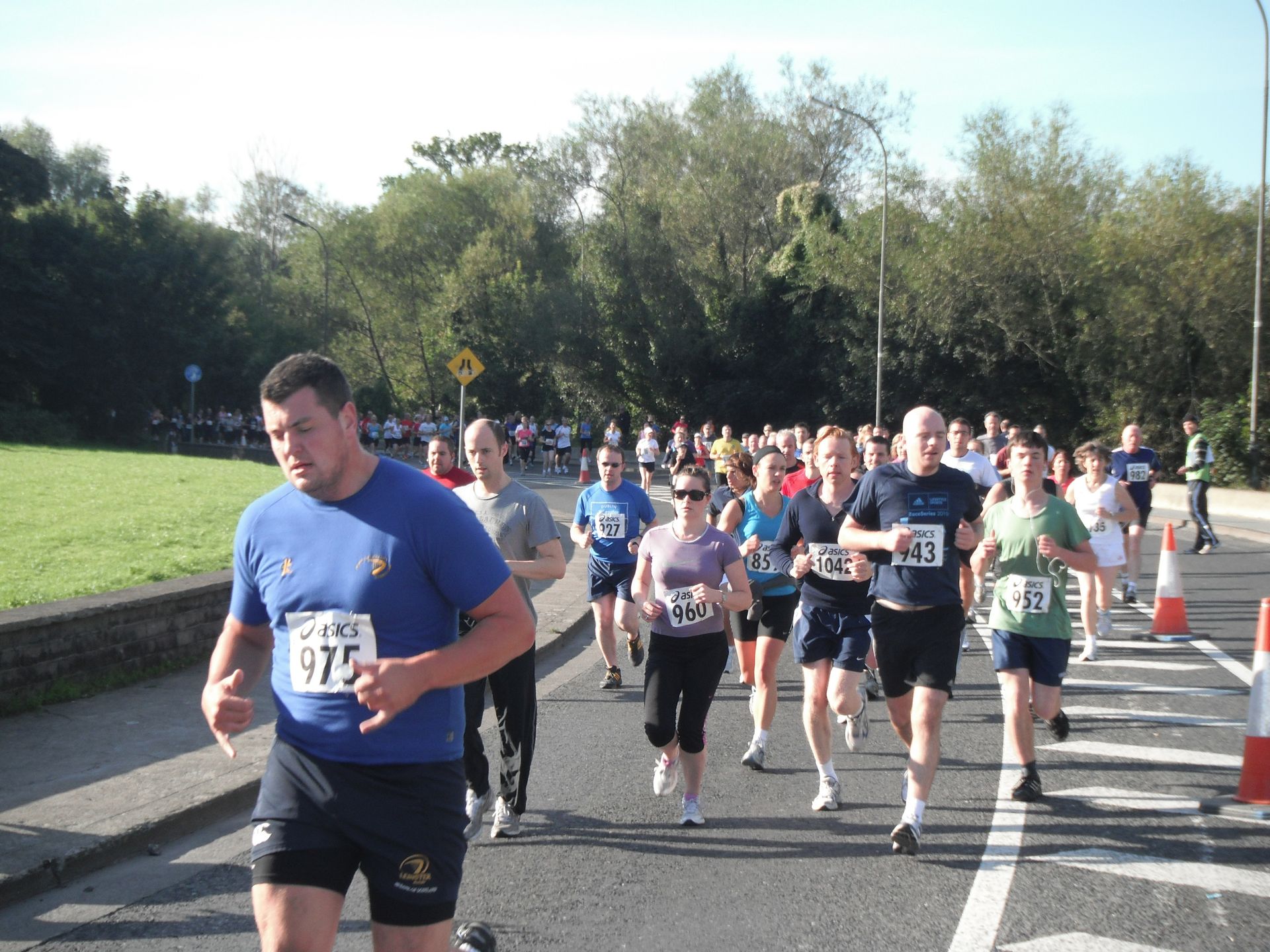 A man in a blue shirt has the number 475 on his shirt