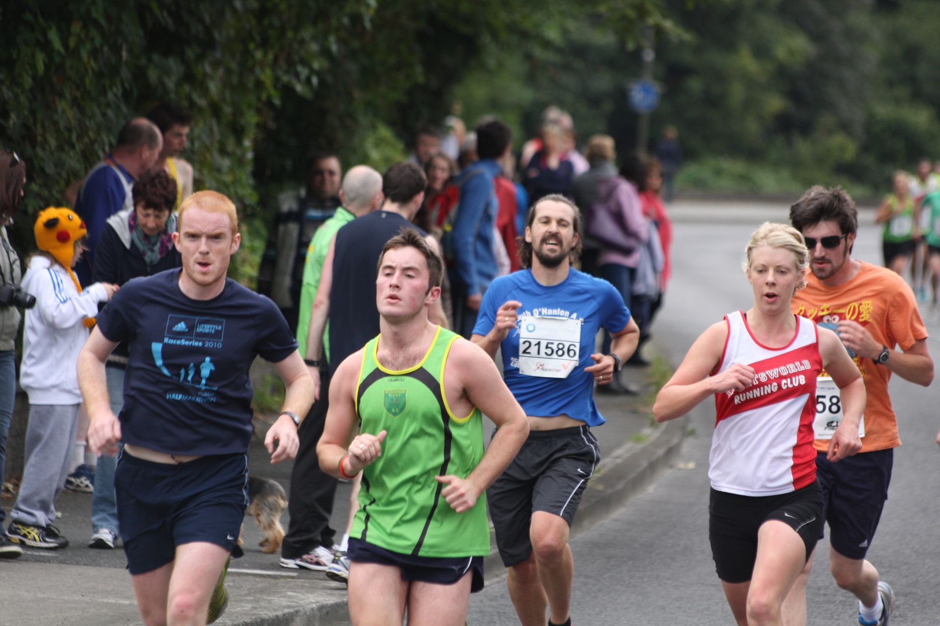 A group of people are running a marathon and one of them has the number 21284 on his shirt