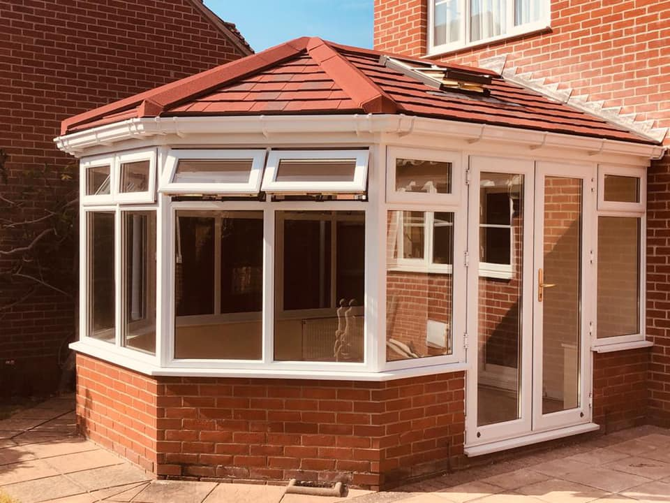 Conservatory installation with aluminium bifold doors
