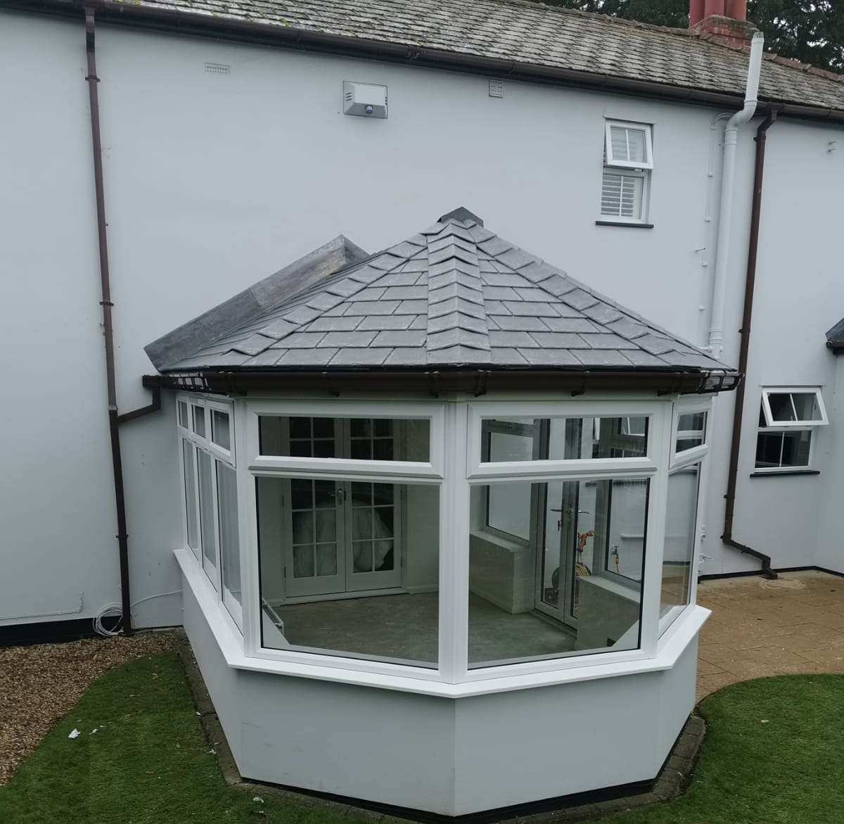 Victorian conservatory installation on a grey home