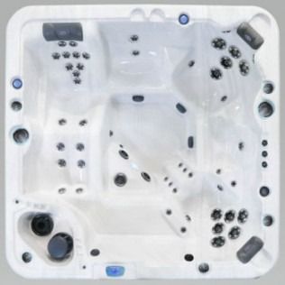 Overhead view of a white, square hot tub with multiple jet clusters and seating areas.