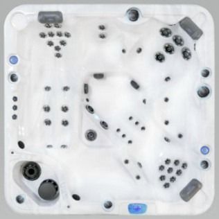 Top-down view of a white square hot tub with numerous jets and seating areas.