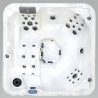 Overhead view of a white, square hot tub with multiple jets.